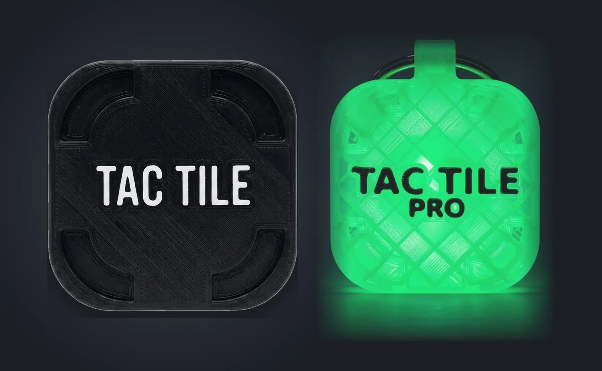A standard Blackout tile beside an Aurora Pro tile glowing green